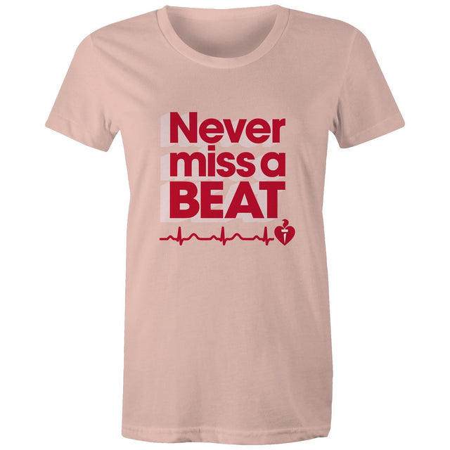Pale pink Heart Foundation women's t-shirt featuring heartbeat line and Never miss a BEAT tag line printed in red. Developed to raise awareness of heart health.