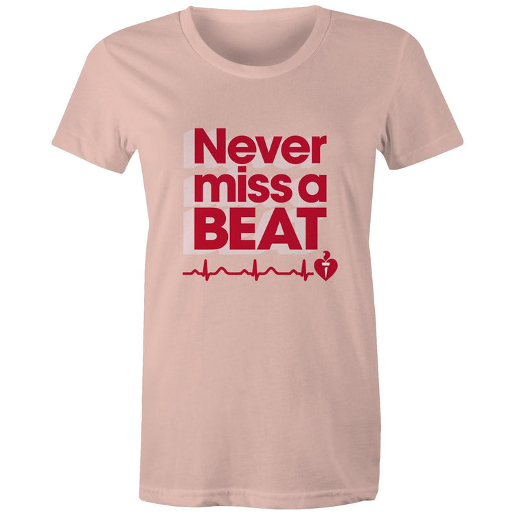 Pale pink Heart Foundation women's t-shirt featuring heartbeat line and Never miss a BEAT tag line printed in red. Developed to raise awareness of heart health.