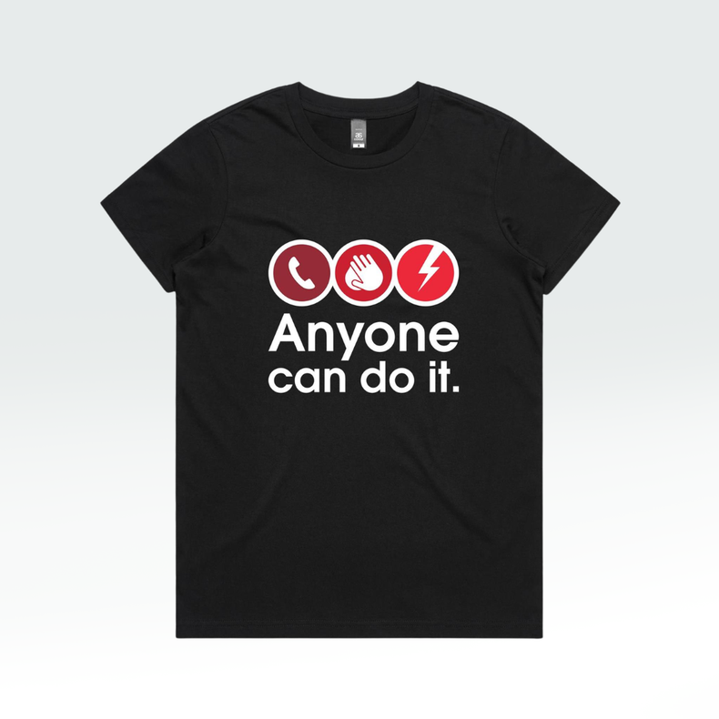 A black short-sleeve crewneck t-shirt with a graphic on the chest showing three red circular icons (a telephone, a hand, and a lightning bolt) above the white text 'Anyone can do it.'.
