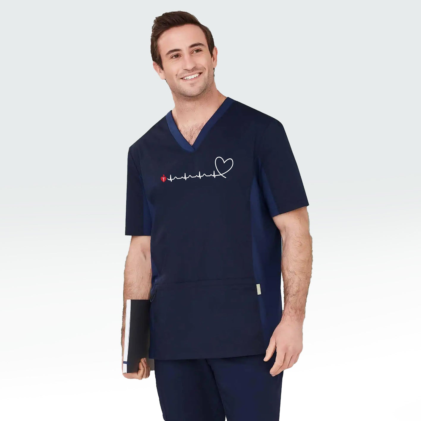 Model wearing a men's navy scrub top featuring heartbeat line across front chest ending with stylised heart shape and incorporating Heart Foundation brand mark.