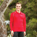 Young man in outdoor setting modelling Heart Foundation Walking's red long sleeved polo shirt, showing white collar accents on raglan sleeve seam and collar.