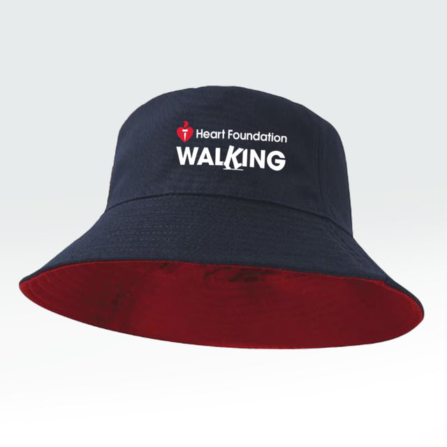 Navy bucket hat with reversible red interior and 'Heart Foundation Walking' text on a light gray background