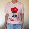 Person wearing a pink t-shirt with a cartoon heart design and text.