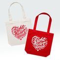 Two canvas tote bags on a light gray background, one in off-white with a red printed design and one in red with a white printed design. Both bags feature the text 'Fight heart disease' inside a heart outline with small medical icons.