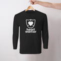 Mens/unisex long sleeve t-shirt displayed on hanger featuring Heart Warrior print centre chest.