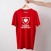 Red mens/unisex short sleeve Heart Foundation t-shirt displayed on hanger with Heart Warrior print to centre chest.