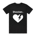 A black short-sleeve crewneck t-shirt with a white graphic on the front featuring the word 'Shocker' and a broken heart with a lightning bolt inside, shown against a light gray gradient 