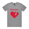 A grey marle short-sleeve crewneck t-shirt with a red graphic on the front featuring the word 'Shocker' and a broken heart with a lightning bolt inside, shown against a light gray gradient 