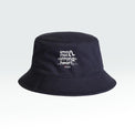 Navy bucket hat with the slogan Small steps strong heart featured on gradient grey background