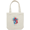 Cream canvas tote bag featuring an anatomical heart drawing shown on a white background.