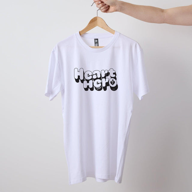 White mens/unisex short sleeve Heart Foundation t-shirt shown on hanger with Heart hero print to centre chest.