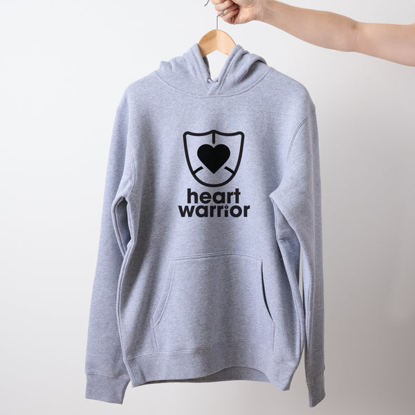Light grey marle Heart Foundation unisex hoodie featuring heart warrior design in black print and displayed on hanger