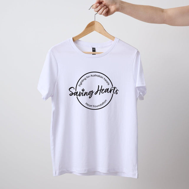 Women's short sleeve white Heart Foundation t-shirt displayed on hanger with Saving hearts print to centre chest.