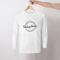 White mens/unisex long sleeve Heart Foundation t-shirt displayed on hanger with Saving hearts print to centre chest.