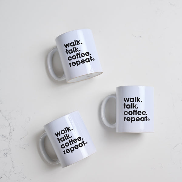 Heart Foundation white ceramic mug with Walk.Talk.Coffee.Repeat. slogan in black print