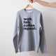Light grey marle Heart Foundation unisex sweatshirt featuring walk.talk.coffee.repeat slogan in black print and displayed on hanger.