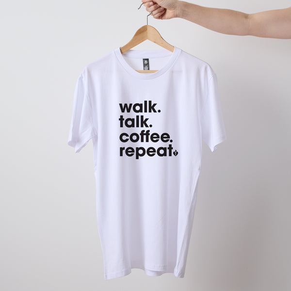 Mens/unisex short sleeve white Heart Foundation t-shirt displayed on hanger with Walk.Talk.Coffee.Repeat print to centre chest.