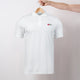 White Heart Foundation unisex polo shirt featuring Walking logo and displayed on hanger.