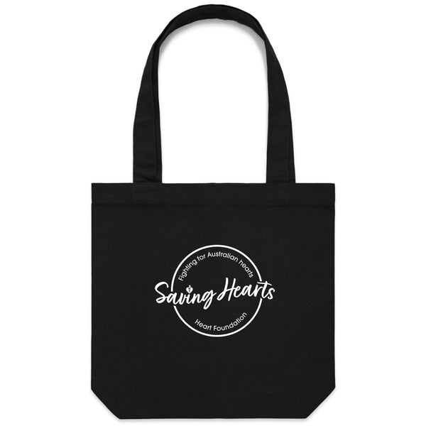 Heart Foundation black canvas tote bag shown with Saving Hearts design in white print. on the front