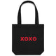 Heart Foundation black canvas tote bag with XOXO design in red print on the front.